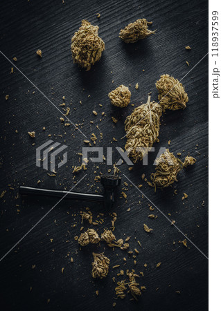 Dry CBD cannabis with metal smoking pipe Dry CBD cannabis with metal smoking pipe 118937599