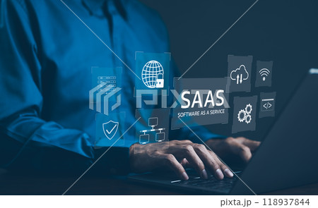 SaaS Concept, Software as a Service, A man types on laptop with digital icons representing various aspects of Software as a Service (SaaS), emphasizing modern technology platforms and cloud computing. 118937844