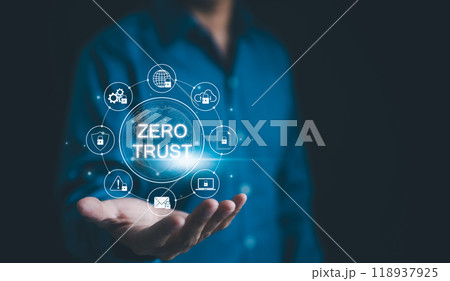 Zero Trust Security Concept. A person holds a holographic representation of "Zero Trust" security model surrounded by various security icons, emphasizing cybersecurity principles. Network access, 118937925