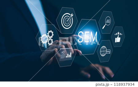 SEM Search Engine Marketing Concept. Businessman touching virtual icons representing search engine marketing, including target, analytics, gears, ads, and global reach, digital marketing strategies. 118937934