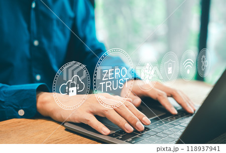 Zero Trust Security Concept. A person types on a laptop with virtual icons zero trust security, cloud protection, business information network security, shields, connectivity, cybersecurity measures, Zero Trust Security Concept. A person types on a laptop with virtual icons zero trust security, cloud protection, business information network security, shields, connectivity, cybersecurity measures, 118937941