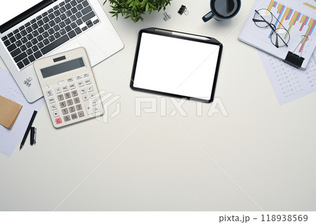Top view digital tablet, laptop, calculator and document on white desk 118938569