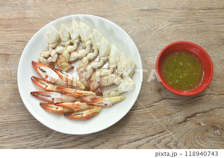 steamed flower crab meat paddle and claw on plate dipping Thai spicy seafood sauce steamed flower crab meat paddle and claw on plate dipping Thai spicy seafood sauce 118940743