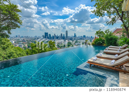 A swimming pool with lounge chairs and a view of the city 118940874