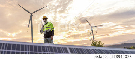 Professional Man Energy Engineer Holding the Solar Panel. Alternative energy engineers hold solar panels samples while learning design 118941077