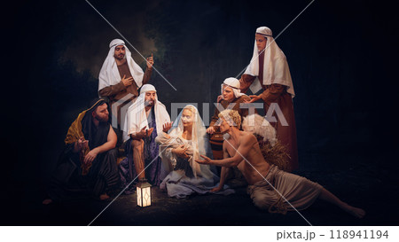 Biblical nativity scene showing Mary, baby Jesus and shepherds with angel. Peaceful representation of the birth of Jesus Christ Biblical nativity scene showing Mary, baby Jesus and shepherds with angel. Peaceful representation of the birth of Jesus Christ 118941194