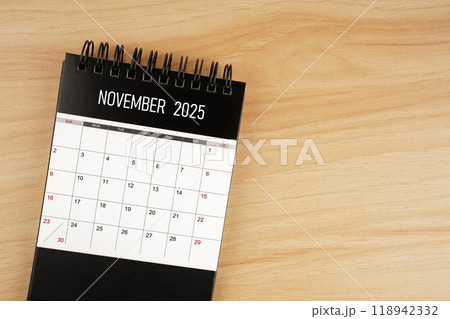 November desk calendar for 2025 year on wooden floor. November desk calendar for 2025 year on wooden floor. 118942332