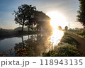 A Serene Sunrise Unfolds Over a Misty River Landscape, Creating a Beautiful Morning Scene 118943135