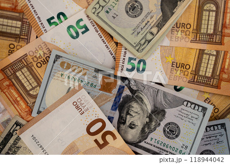 Close-up of various denominations of Euro and US Dollar banknotes. Currency exchange and international finance concept  118944042