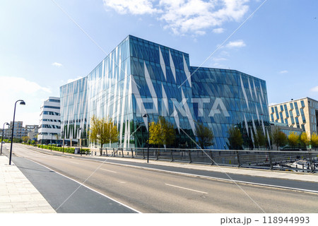 Modern glass office building in an expensive area of Copenhagen, Denmark. Modern glass office building in an expensive area of Copenhagen, Denmark. 118944993