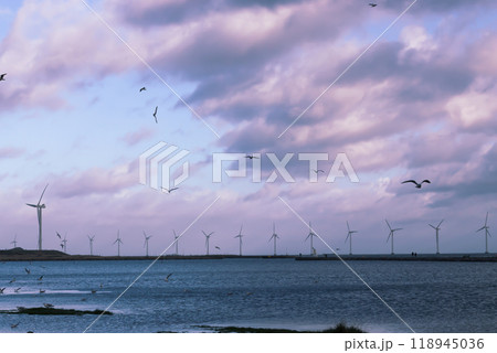 Wind turbine farm power genarator in beautiful nature landscape for production of renewable green energy. Wind turbine farm power genarator in beautiful nature landscape for production of renewable green energy. 118945036
