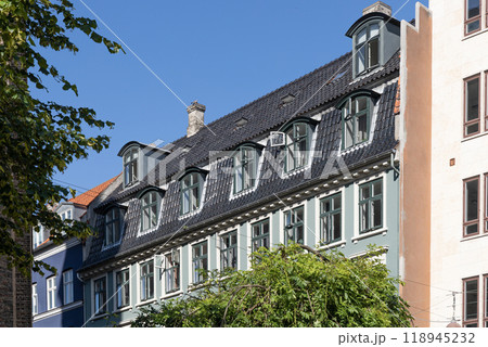 Downtown Copenhagen with old colored houses on a sunny day. Downtown Copenhagen with old colored houses on a sunny day. 118945232