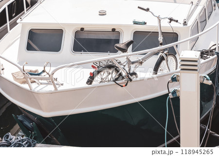 Motor boat or yacht is charging at the pier 118945265