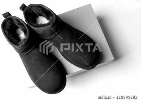 Fashionable modern short UGG boots made of sheep fur for the winter. Fashionable modern short UGG boots made of sheep fur for the winter. 118945292