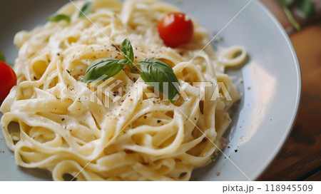 Creamy Fettuccine Alfredo Pasta with Parmesan Cheese and Basil Garnish_3 118945509