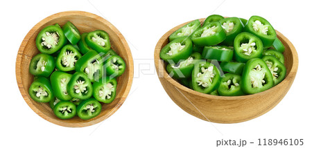 sliced jalapeno pepper in wooden bowl isolated on white background. Green chili pepper . Top view. Flat lay sliced jalapeno pepper in wooden bowl isolated on white background. Green chili pepper . Top view. Flat lay 118946105