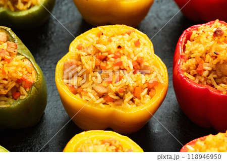 Baked stuffed pepper ( paprika ) with rice , carrot and meat . Top view on rustic background Baked stuffed pepper ( paprika ) with rice , carrot and meat . Top view on rustic background 118946950