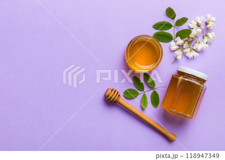 honey jar with acacia flowers and leaves. fresh honey top view flat lay honey jar with acacia flowers and leaves. fresh honey top view flat lay 118947349