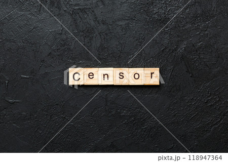 Censor word written on wood block. Censor text on cement table for your desing, concept 118947364