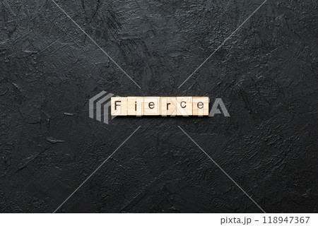 Fierce word written on wood block. Fierce text on cement table for your desing, Top view concept 118947367