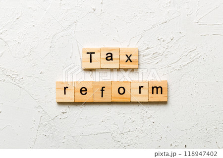 tax reform word written on wood block. tax reform text on cement table for your desing, concept tax reform word written on wood block. tax reform text on cement table for your desing, concept 118947402