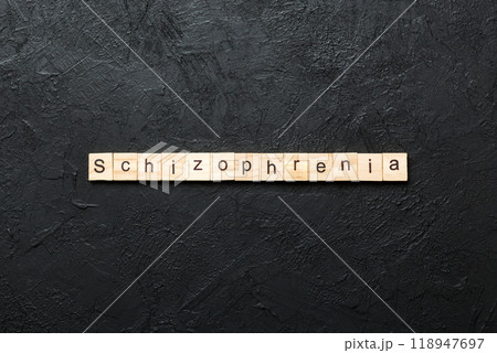 schizophrenia word written on wood block. schizophrenia text on table, concept 118947697