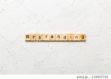 rebranding word written on wood block. rebranding text on table, concept 118947720