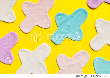 Eco-friendly reusable fabric women's pads. set of colorful bright reusable menstrual pads. zero waste woman periods concept top view with copy space 118947976