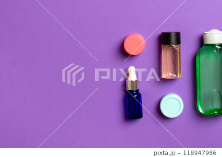 Cosmetics SPA branding mock-up, top view with copy space. set of tubes and jars of cream flat lay on colored background 118947986