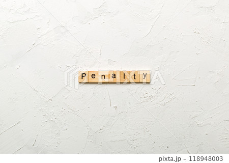 PENALTY word written on wood block. PENALTY text on cement table for your desing, concept 118948003