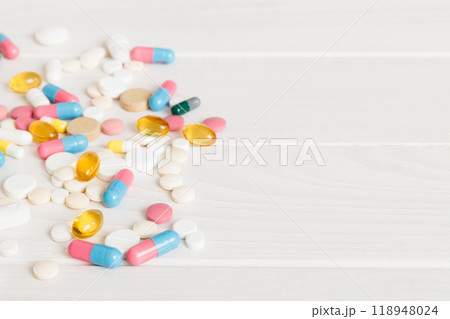 Collection Of Various Medical Tablets And Pills. Assorted pharmaceutical medicine pills, tablets and capsules on table background. Heap of assorted various medicine tablets. Health care Collection Of Various Medical Tablets And Pills. Assorted pharmaceutical medicine pills, tablets and capsules on table background. Heap of assorted various medicine tablets. Health care 118948024