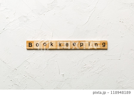 bookkeeping word written on wood block. bookkeeping text on table, concept 118948189