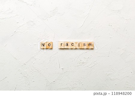 No racism word written on wood block. No racism text on table, concept No racism word written on wood block. No racism text on table, concept 118948200