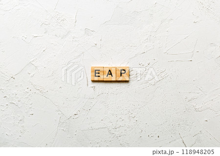 EAP word written on wood block. employee assistance program text on table, concept 118948205