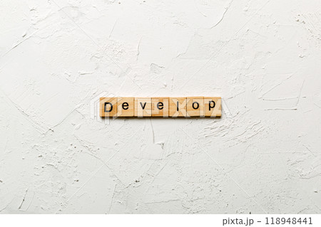 Develop word written on wood block. Develop text on cement table for your desing, concept 118948441