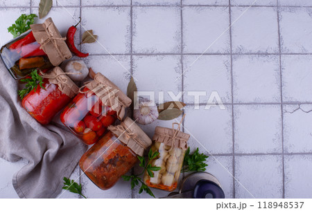 Pickled vegetables in glass jars. Pickled vegetables in glass jars. 118948537