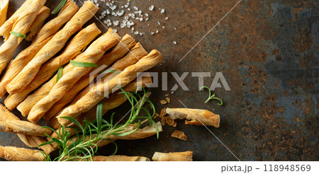 Homemade grissini breadsticks with sea salt and rosemary. 118948569