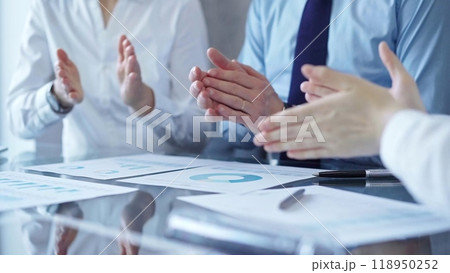 Business team clapping hands after successful presentation celebrating positive results. Diverse people group 118950252