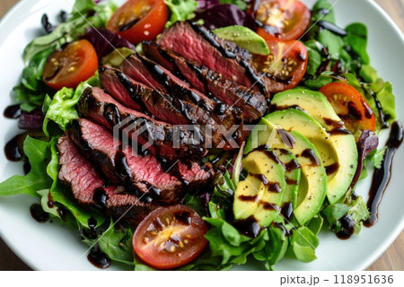 Fresh Steak Salad with Mixed Greens, Cherry Tomatoes, Avocado Slices, and Balsamic Glaze - Delicious Meal Concept Fresh Steak Salad with Mixed Greens, Cherry Tomatoes, Avocado Slices, and Balsamic Glaze - Delicious Meal Concept 118951636