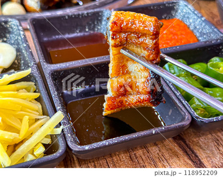 Korean food. Grilled eel. Three flavors. Spicy sauce, salt, soy sauce Korean food. Grilled eel. Three flavors. Spicy sauce, salt, soy sauce 118952209
