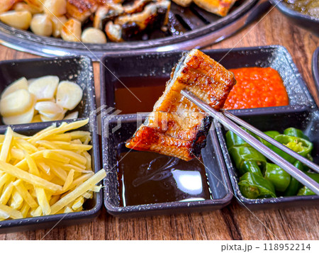 Korean food. Grilled eel. Three flavors. Spicy sauce, salt, soy sauce Korean food. Grilled eel. Three flavors. Spicy sauce, salt, soy sauce 118952214