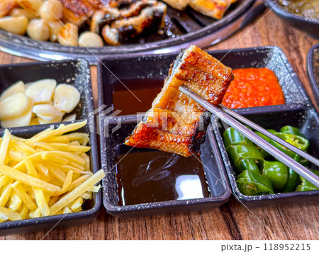 Korean food. Grilled eel. Three flavors. Spicy sauce, salt, soy sauce Korean food. Grilled eel. Three flavors. Spicy sauce, salt, soy sauce 118952215