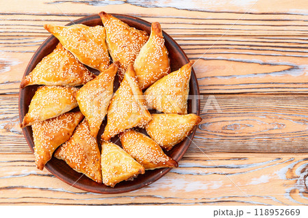 Homemade triangle puff pastry with meat on rustic background . Samosa 118952669