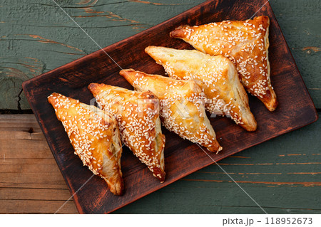 Homemade triangle puff pastry with meat on rustic background . Samosa 118952673