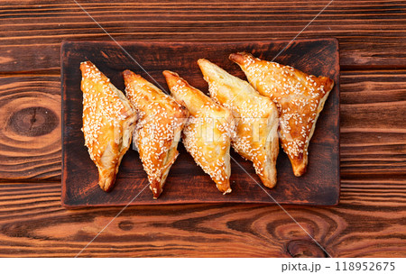 Homemade triangle puff pastry with meat on rustic background . Samosa 118952675