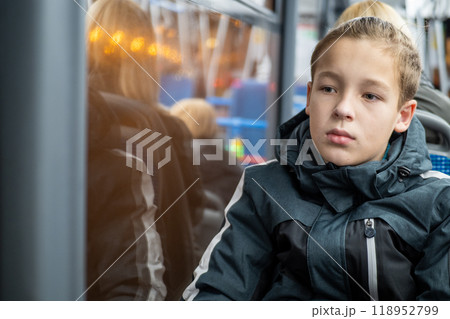 Young boy sitting on a bus Young boy sitting on a bus 118952799
