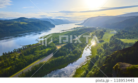 Aerial View of Columbia River Meandering Through Lush Valley at Golden Hour Aerial View of Columbia River Meandering Through Lush Valley at Golden Hour 118953445