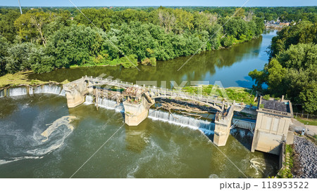 Maumee River Dam aerial chocked by tree logs and algae leading to swirling waters in Fort Wayne, IN Maumee River Dam aerial chocked by tree logs and algae leading to swirling waters in Fort Wayne, IN 118953522