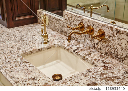 Elegant Granite Bathroom Sink with Brass Faucets Elegant Granite Bathroom Sink with Brass Faucets 118953640