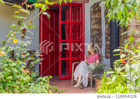 Female tourist in a colonial house in San Cristobal de las Casas, Mexico. Cultural exploration, architecture, and travel experience concept 118954329